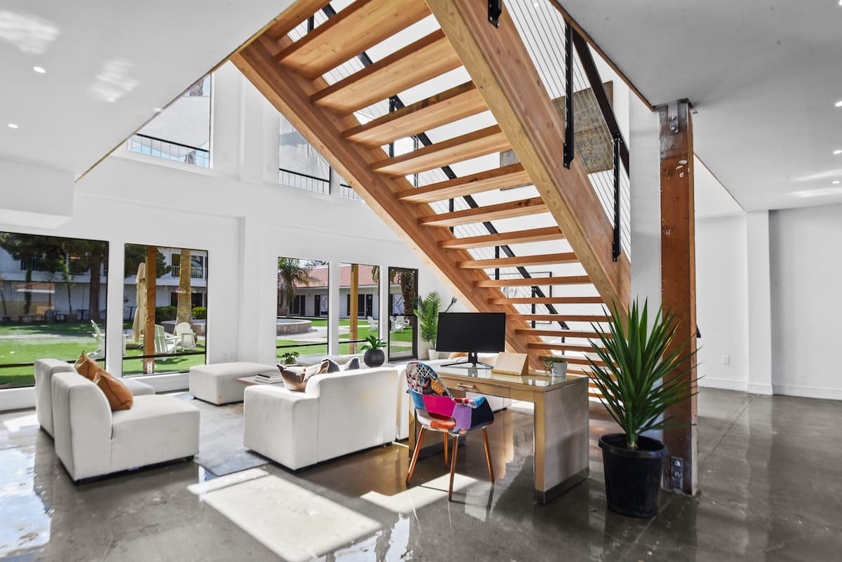 The open workspace beneath the timber staircase